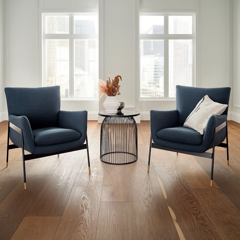 two blue armchairs on a brown hardwood floor from BOOTH FLOORING INC in Tolland, CT