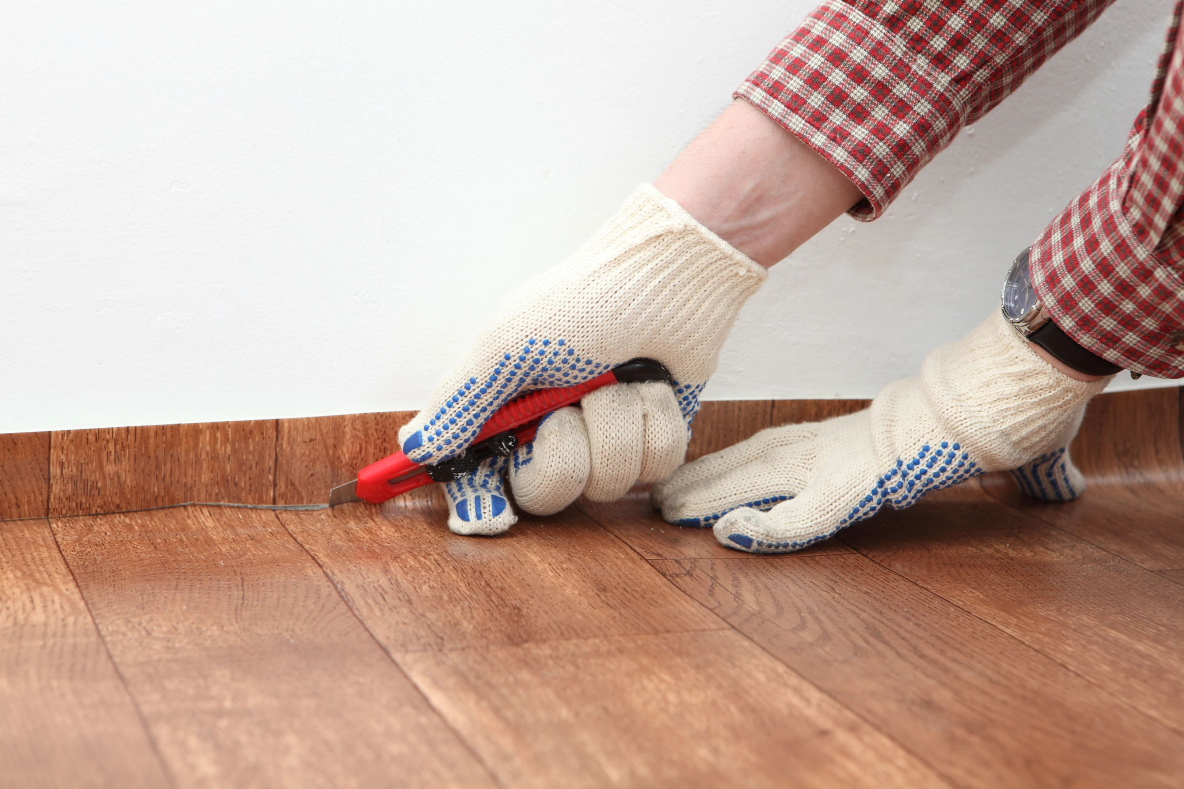 person installing a vinyl sheet