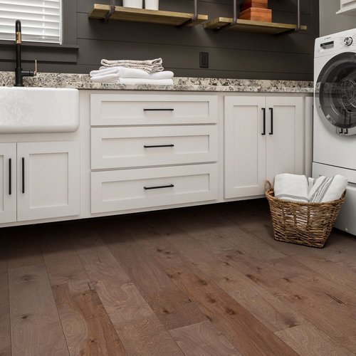 white bathroom cabinets and brown hardwood floor from BOOTH FLOORING INC in Tolland, CT